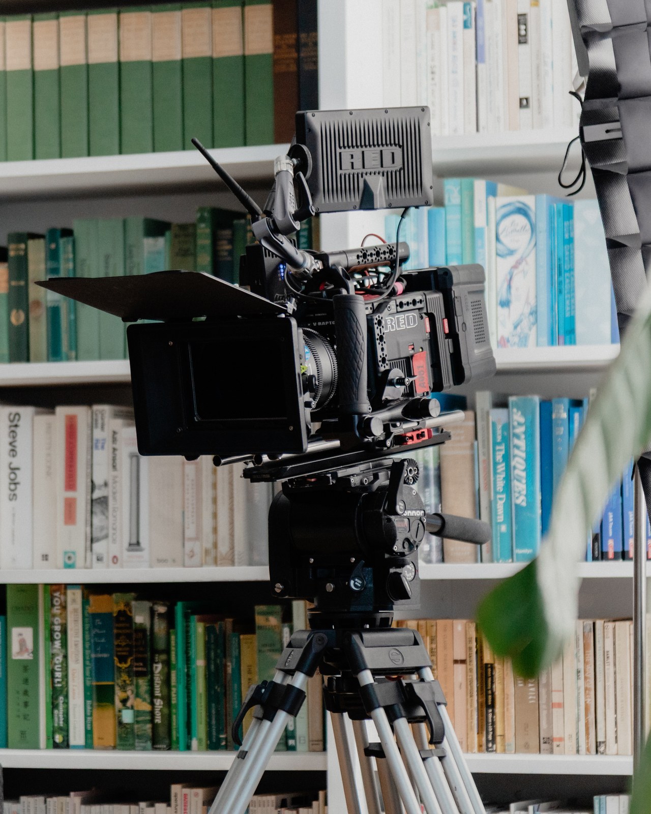 Behind the scenes: the production camera positioned in front of the Book Outlet set’s bookshelves