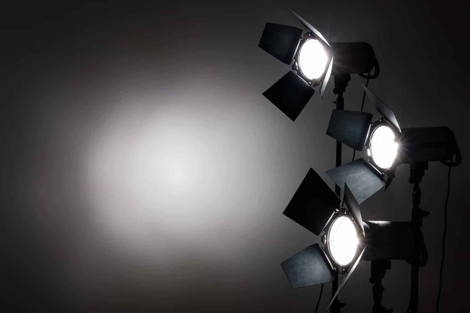 Several reflectors on the black background in photo studio.