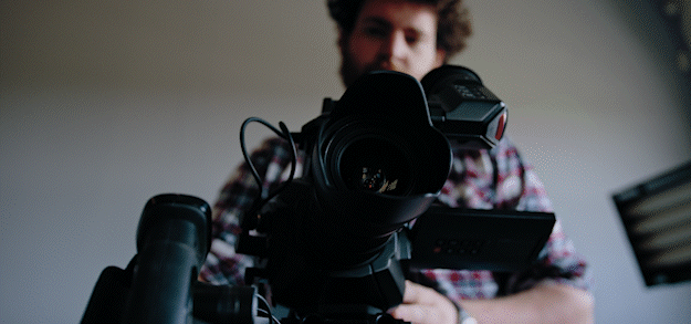cameraman recording with camera